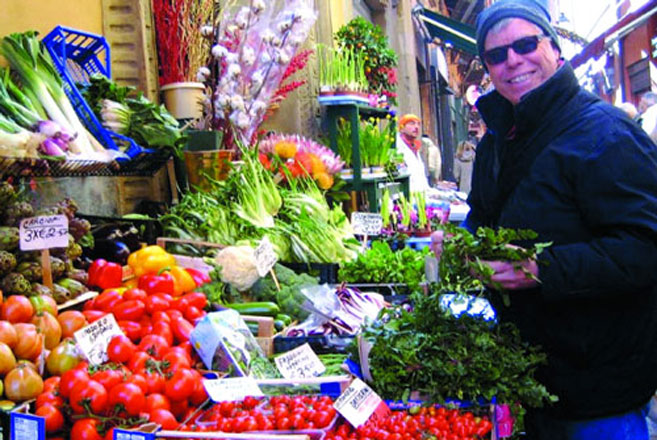 Man picks out fresh vegetables at the farmers market