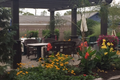Cup 2 Cafe has a new outdoor dining patio with seating for 50, complete with teak dining furniture, pergula and lounge area