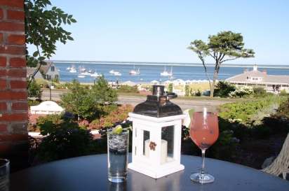 Enjoy a cocktail on the outside veranda of Chatham Bars Inn with a view of both the calm waters of Chatham Harbor and the rougher Atlantic Ocean.
