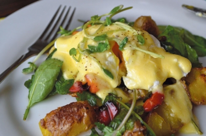 Potato hash on a bed of organic spinch topped with local egg and Hollandaise sauce at Parsonage Inn. 