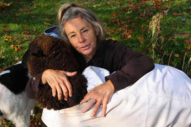 Veronica Worthington hugs a sheep